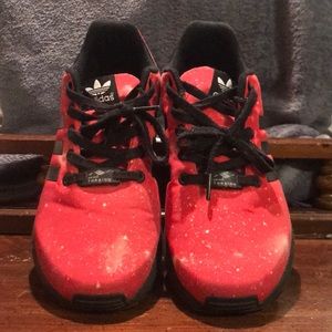 Red, star-themed Adidas sneakers